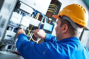 An electrician checking the cables