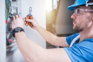 An Electrician at a Residential Home Performing Electrical Panel Repair in Frederick, MD
