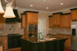 Cabinets in a kitchen with a lamp 