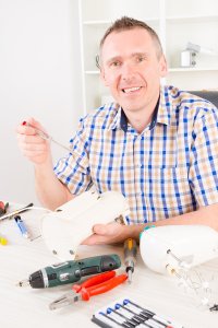 The electrician checking machine with equipment at Frederick, MD