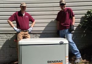 2 Men standing in front of the generator