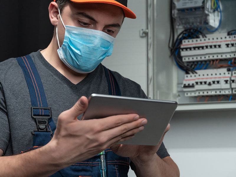 A person operating a tablet 