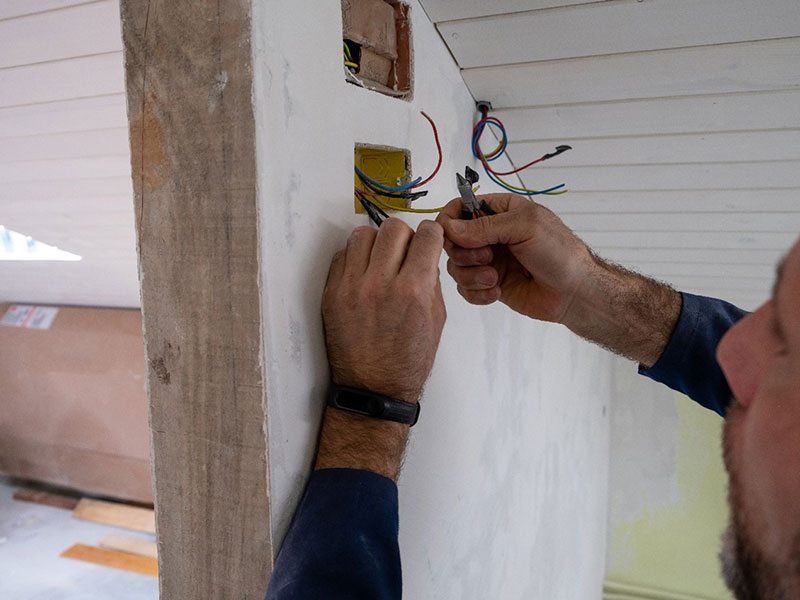 A Provident Electric Technician Fixing Electrical Wires at a Residential House in Frederick, MD
