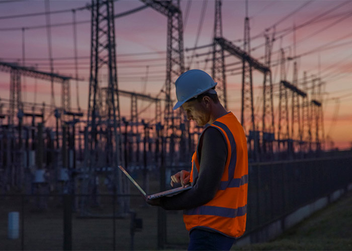 The Worker Understanding Power Surges with a laptop at Frederick MD