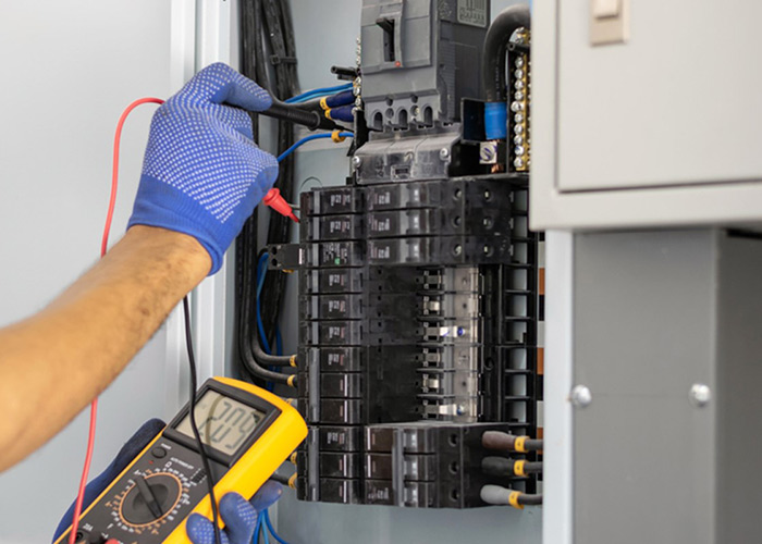 worker repairing electrical device