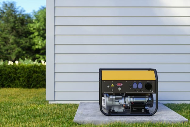 A compact portable generator positioned in front of a residential home in Frederick, MD
